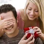 girl giving guy a gift